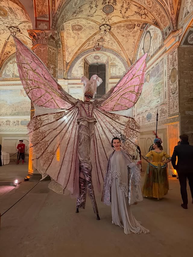 DIVINE evening with @thetuscangun ❣️We had the Huge honor to host @carnevaledifirenze in the Salone dei Cinquecento at Palazzo Vecchio!!!All proceeds from the evening went in support of @fondazionetommasinobacciotti Paolo&Barbara Bacciotti are Saintly.Thankyou for all you do🙏Congratulations also to @antoniasautter who’s art direction & costume design were Incredible.Such a magical evening in Medici Splendor.To avoid looking like we were going to a Renaissance Fair,I came up with my own looks for Gabriele & I. Big thanks to *Gown @ermannoscervino 🩶*Cape @capas_sesena 🩶My headpiece&Gabriele’s mask-@maisonvivascarrionofficial 🩶Thanks to #RandaEid @diego_bandinelli @oncextraordinaryevents