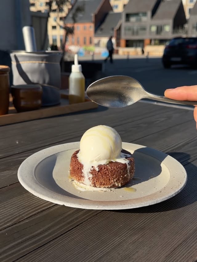 CHOCOLATE AND MISO FONDANT Our twist on a classic Fondant has a chocolate and elderflower peaso base. The peaso is made in house with split peas and leftover pulp from elderflower oil production. Plum kernel ice cream and finished with elderflower oil! by @poplburger