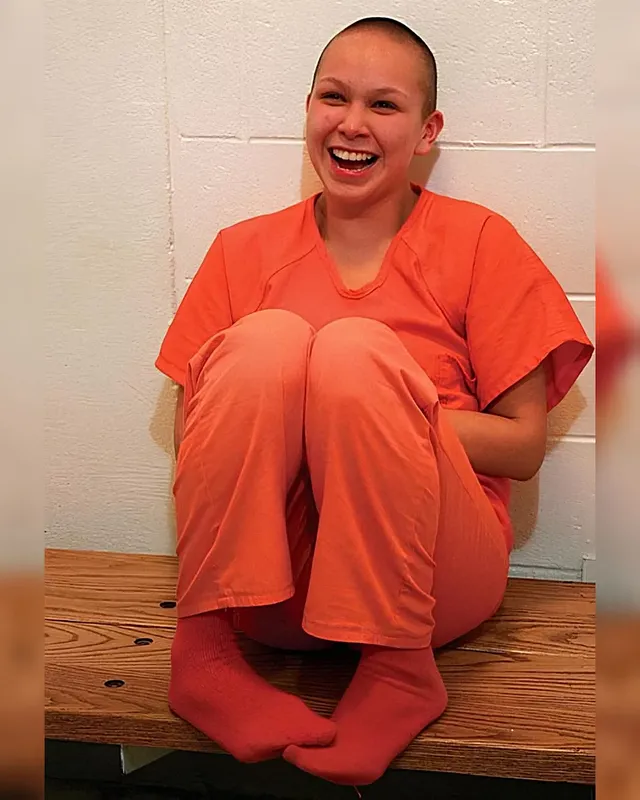 Tonia Gopher. Cutting off all her hair and going bald is something this young lady had considered before, but she never had the courage to actually go through with it. Now that she is in jail for felony criminal mischief though, she finally figured "Why not?". She could be locked up for quite a while so she will probably not have any dates, job interviews, or picture days in the foreseeable future anyway. And since her job mopping floors here earns her next to nothing it really doesn't hurt to not have to buy any hair care products from the commissary. Not to mention that she was able to donate her hair to charity, which she herself was really happy with. It allowed her to actually do something meaningful to make up for her wrongdoings, instead of just being stuck in her cell and doing absolutely nothing but wait and wait for her punishment to finally be over.#handcuffs #handcuffed #handcuffedwoman #handcuffedgirl #shackled #chained #inmate #court #sentenced #arrested #prison #jail