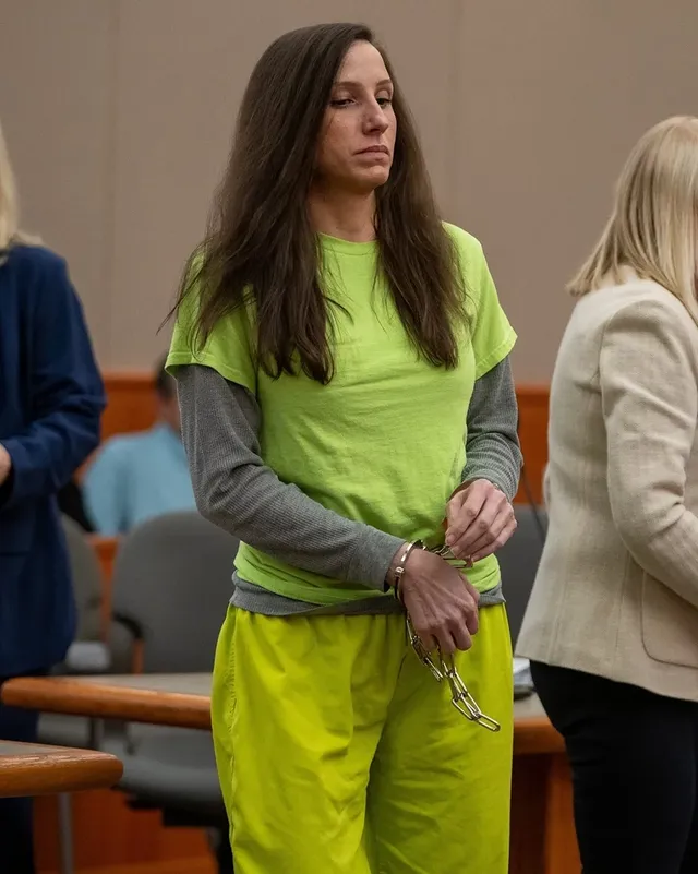 Kouri Richins.Not only did this woman murder her own husband, she then also profiled herself as a poor grieving widow and tried to profit off it by writing a children's book about loss. But fortunately her deception was uncovered and she was exposed to the world for who she really is, a cold blooded killer. And while she did everything she could to draw out her already incredibly lengthy trial and still falsely claims to be innocent, justice has finally been served. She was just sentenced to life without parole. So now here she is, dressed in her hideous jail attire, helplessly locked in cuffs and chains, and on her way to spend every single day of the rest of her life in a cage. It is a miserable and pathetic fate, and of course that is exactly what she deserves.#handcuffs #handcuffed #handcuffedwoman #handcuffedgirl #shackled chained inmate court sentenced arrested prison jail
