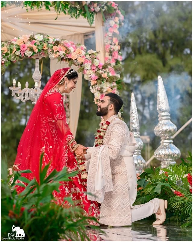In these photographs, the bride’s happiness isn’t just visible—it’s truly felt. Every moment of the varmala ceremony reflects pure joy, genuine laughter, and the excitement of living one of the most precious days of her life. Standing beside the person she has chosen to spend forever with, every smile carries a story and every glance holds an emotion that words can hardly describe. The beautiful floral setup, sparkling lights, and pleasant weather seem to come together perfectly, making the entire atmosphere feel magical. These are not just wedding portraits; they are timeless memories filled with love, warmth, and unforgettable emotions. Beautifully preserved by JSW @js_wedding_ @mayank_singh_photography , each frame captures the essence of a moment that will remain priceless for a lifetime. ✨🤍#varmala #nikon #weddingphotographer #picoftheday📷 #bhyp by @witty_wedding